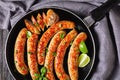 Breakfast pork sausage links with fresh basil Royalty Free Stock Photo