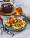 Breakfast with potato waffle, salmon and avocado