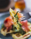 Breakfast with potato waffle, salmon and avocado