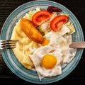 Breakfast with potatoes, egg, cutlet and salad. Royalty Free Stock Photo