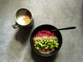 Breakfast: Raspberry chia bowl with kiwifruit, hemp seeds, hazelnut butter