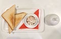 Breakfast in the restaurant, tuna with a two toasts on the white background