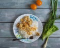 Breakfast with rice and chicken meat with a bunch of greens