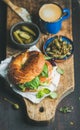 Breakfast with salmon, avocado, cream-cheese, basil bagel, espresso coffee, capers Royalty Free Stock Photo