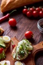 Breakfast sandwich with homemade paste, vegetables and fresh greens, shallow depth of field Royalty Free Stock Photo