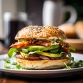 Breakfast sandwich packed with eggs, bacon, avocado Royalty Free Stock Photo