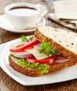 Breakfast sandwich with sliced sausage and tomato Royalty Free Stock Photo