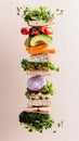 A breakfast sandwich stack showcases an array of fresh vegetables layered between slices of whole grain bread, arranged Royalty Free Stock Photo