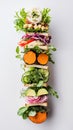 A breakfast sandwich stack showcases an array of fresh vegetables layered between slices of whole grain bread, arranged Royalty Free Stock Photo