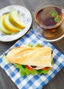 Breakfast with sandwich, tea and melon Royalty Free Stock Photo