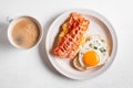 Breakfast sandwiches with fried egg, bacon and scrumble Royalty Free Stock Photo