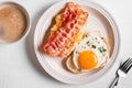 Breakfast sandwiches with fried egg, bacon and scrumble Royalty Free Stock Photo