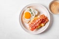 Breakfast sandwiches with fried egg, bacon and scrumble Royalty Free Stock Photo