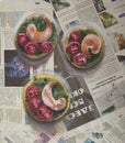 Breakfast of sandwiches with shrimps and cherry tomatoes on real newspaper oil painting. Russian newspaper in background