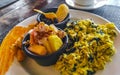 Breakfast scrambled eggs spinach fruit potatoes nicely arranged on plate