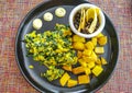 Breakfast scrambled eggs spinach fruit potatoes nicely arranged on plate