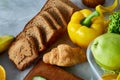 Breakfast served with bell pepper, croissants and fruits, top view, close-up, selective focus Royalty Free Stock Photo