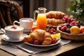 Breakfast served with coffee, croissants and fruits on wooden table, Rice with vegetables and shrimps on Black background, top