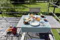 Breakfast served with coffee, orange juice, croissants, cheese and fruits on the village terrace. Balanced diet