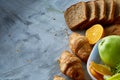 Breakfast served with croissants and fruits, top view, close-up, selective focus Royalty Free Stock Photo