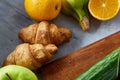 Breakfast served with croissants and fruits, top view, close-up, selective focus Royalty Free Stock Photo