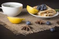 Breakfast served with mint tea and pancakes with blueberry, lemon, star anise