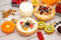 Breakfast Served in the morning with Butter bread and corn flakes Whole grains and raisins with milk in cups and Strawberry, Blueb Royalty Free Stock Photo