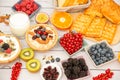 Breakfast Served in the morning with Butter bread and corn flakes Whole grains and raisins with milk in cups and Strawberry, Blueb Royalty Free Stock Photo