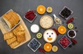 Breakfast Served in the morning with Butter bread and corn flakes Whole grains and raisins with milk in cups and Strawberry, Blueb