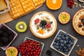 Breakfast Served in the morning with Butter bread and corn flakes Whole grains and raisins with milk in cups and Strawberry, Blueb Royalty Free Stock Photo