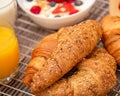 Breakfast Served in the morning with Fruit Yogurt, Butter croissant and corn flakes Whole grains and raisins with milk in cups and Royalty Free Stock Photo