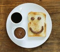 Breakfast serving funny face on the plate Royalty Free Stock Photo