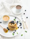 Breakfast set. Blueberry pancakes with fresh Royalty Free Stock Photo