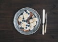 Breakfast set on dark wooden desk: apple and cinnamon pancakes w Royalty Free Stock Photo