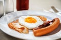 Breakfast set eggs, ham, sausage and bacon under morning light ( Royalty Free Stock Photo