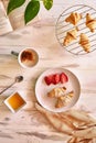 Breakfast set with four freshly-baked croissants, a handful of ripe strawberries Royalty Free Stock Photo