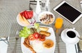 Breakfast set on the table with pancakes, bacon, eggs and coffee Royalty Free Stock Photo