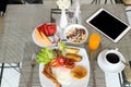 Breakfast set on the table with pancakes, bacon, eggs and coffee Royalty Free Stock Photo