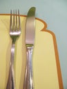 Breakfast setting bread napkin fork knife Royalty Free Stock Photo