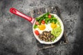 Breakfast skillet pan of fried egg, avocado and mushrooms. Ketogenic diet. Low carb high fat breakfast. Healthy food concept. Royalty Free Stock Photo