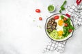 Breakfast skillet pan of fried egg, avocado and mushrooms. Ketogenic diet. Low carb high fat breakfast. Healthy food concept. Royalty Free Stock Photo