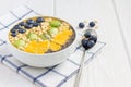 Breakfast smoothie bowl topped with berries, fruits, nuts and seeds Royalty Free Stock Photo