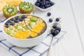 Breakfast smoothie bowl topped with berries, fruits, nuts and seeds Royalty Free Stock Photo