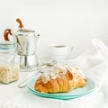 Breakfast and snack background. Fresh croissants and coffee on white table. Square image Royalty Free Stock Photo