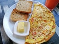 Breakfast of Spanish omelette with toast and butter