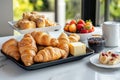 A breakfast spread featuring croissants, pastries, strawberries, butter, and jam Royalty Free Stock Photo