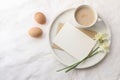 Breakfast spring composition. Mug of latte coffee, bouquet of narcissus, daffodil flowers on marble tray. Blank greeting Royalty Free Stock Photo