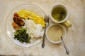 Breakfast Of Steamed Amaranth, Fried Plantain, Egg Roll And White Rice