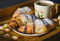 Breakfast still life with coffee and croissants