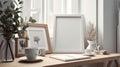 Breakfast still life. Cup of coffee, books and empty picture frame mockup on wooden desk, table Royalty Free Stock Photo